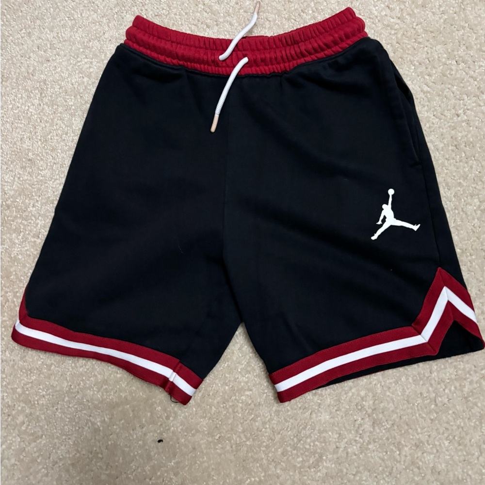 Jordan Black Basketball Shorts with Red Trim and White Jumpman